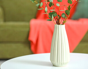 White Vase with Eucalyptus Branches on Coffee Table