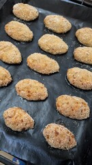 Delicious Golden Brown Baked Snacks Perfectly Arranged on a Baking Sheet Freshly Made