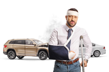 Injured man in a car accident with a damaged vehicle