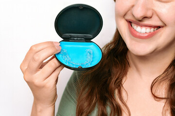 Woman Smiling With Clear Aligner in Case