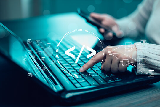 Businessman hand touch with Code html and programming on screen laptop,Programmer development Computer code,web design  coding technology in software, digital software technology development, IoT