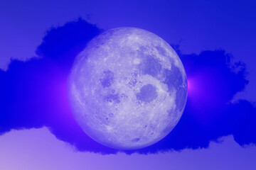 A large blue moon is in the sky, halloween concept