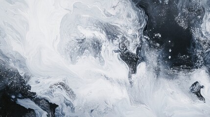 Abstract monochrome fluid art painting with swirling white and black paint creating a dynamic, textured background.
