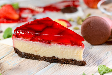 dessert cheesecake with strawberry jelly on a background with decor