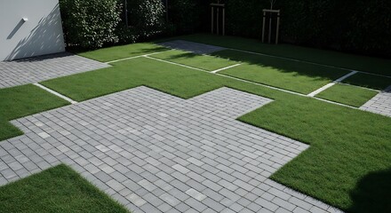 Modern garden design with interlocking paving stones and green grass lawn in geometric pattern