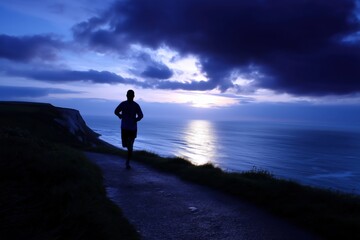 Lone runner jogging along a dramatic cliffside path overlooking the ocean under deep twilight sky