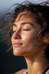 Serene Female Enjoying Sunlight with Closed Eyes and Soft Expression