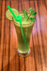 Homemade refreshing summer lemonade drink with lemon slices and ice in glass