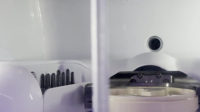 A Machine That Performs Drilling and Cutting for Prosthetic Tooth Molds in a Dental Laboratory