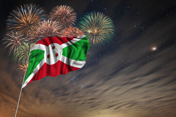 Waving National flag of Burundi and holiday fireworks