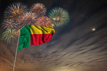 Waving National flag of Benin and holiday fireworks