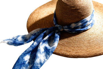 Wide-brimmed straw hat with a tie-dye scarf