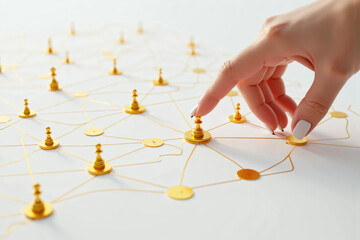 Strategic business concept showing reflective gold pawns at key intersections with human hand reaching to make a move, representing decision-making, leadership, and organizational planning