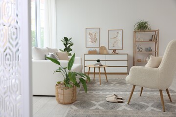 Stylish sofa and other furniture in living room. Interior design