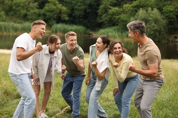 Fototapeta premium Team building. Group of happy people together outdoors