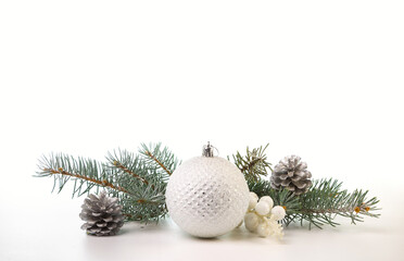 Christmas card with fir branches and Christmas decorations. Copy space.