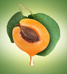 Apricot with drop of oil against green gradient background