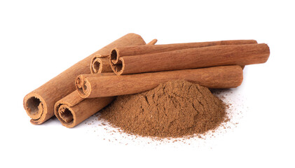 Dry cinnamon sticks on a white background. Cinnamon powder in a spoon.