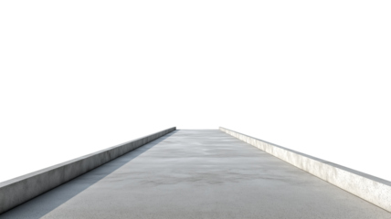 A narrow concrete walkway featuring low side rails with shadows