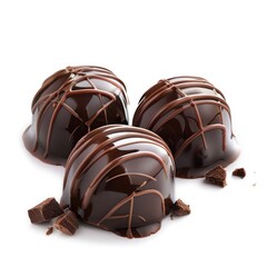 Obraz premium Three dark chocolate truffles, glossy and smooth, with drizzled chocolate, surrounded by chocolate shards, on a white background