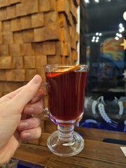 a glass of mulled wine with orange