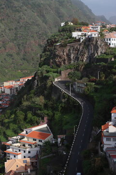 The steep, winding road of Rua Comandante Camacho de Freitas in Ribeira Brava, view from Miradouro de S&atilde;o Sebasti&atilde;o, Madeira, Portugal