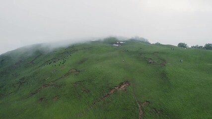 Aerial view of adventure trek in Uttarakhand’s Garhwal Himalayas, passing dense forests and green bugyals, with stunning views of Chaukhamba from the Madmaheshwar trail.