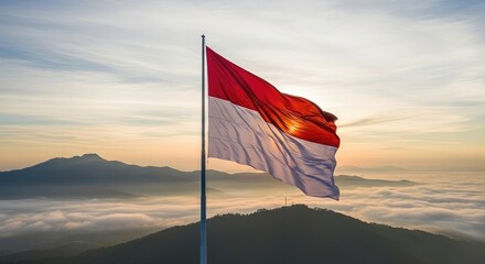 Flag waving over misty mountains sunrise