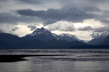 Dark clouds over mountains at beach in Homer, Alaska