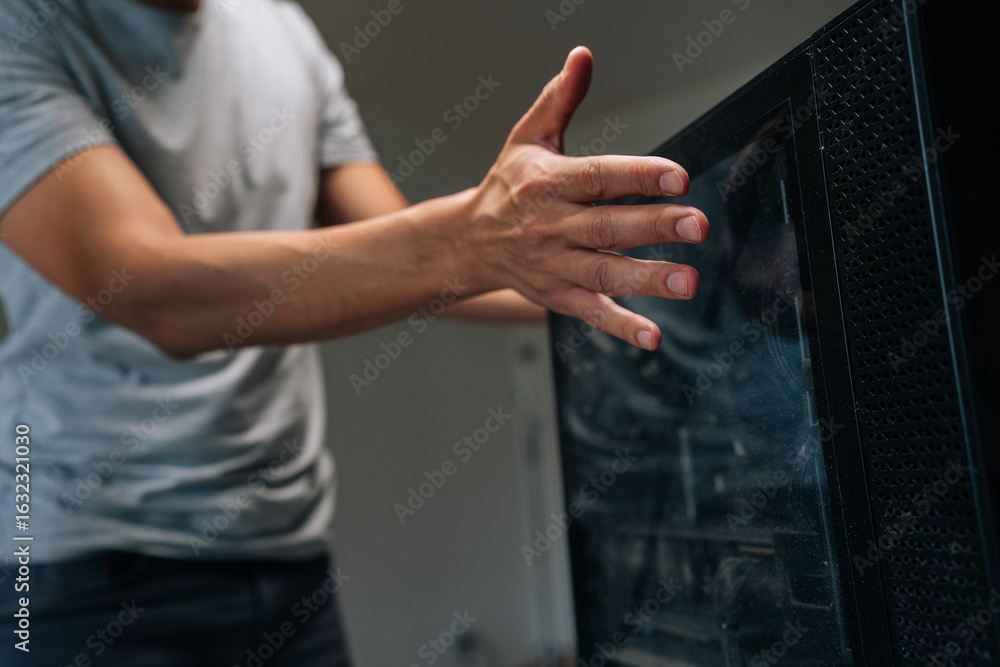 Poster cropped shot of computer technician opening side panel of desktop computer case, preparing for maint