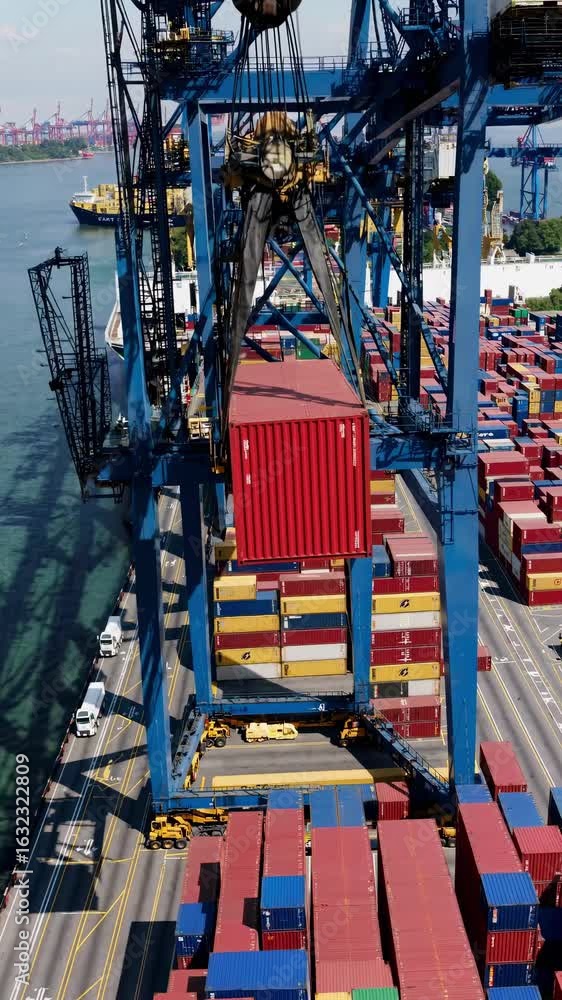 Aufkleber aerial view of a busy port with colorful shipping containers and cranes. the high-angle shot capture