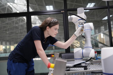 female engineers learn programming software for automated manufacturing technology and for use in...