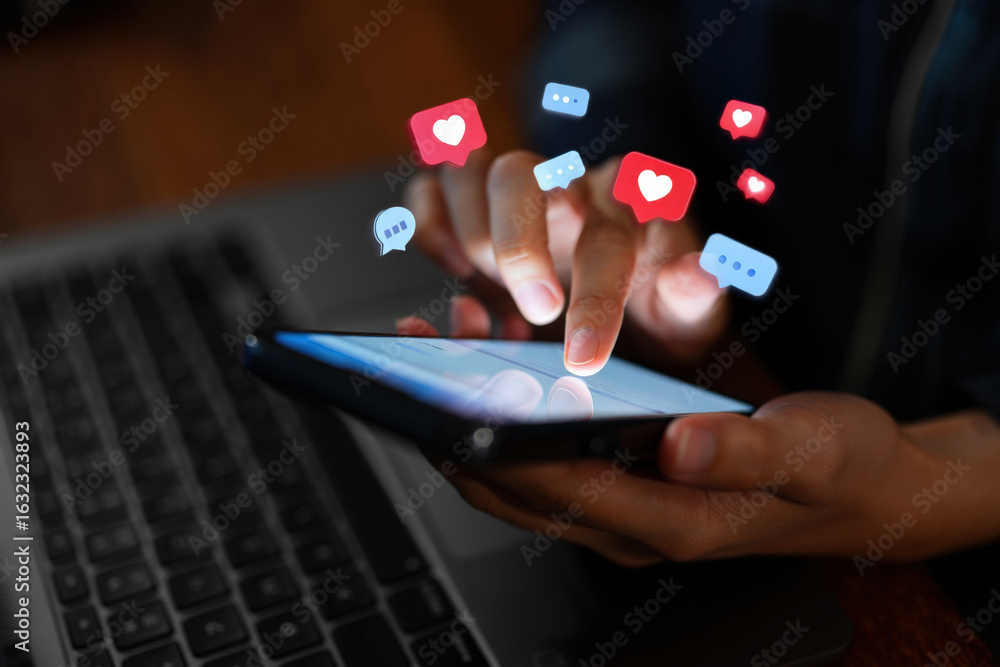 Poster engaging with social media a close up view of hands using a smartphone with floating like and commen
