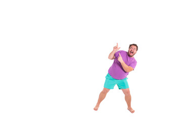 A funny fat man enjoys discounts in a store.