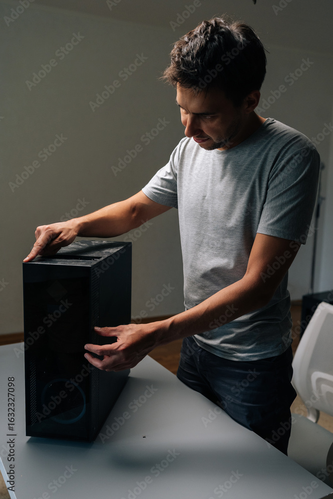Poster vertical portrait of technician checking dust level on computer case, highlighting need for cleaning