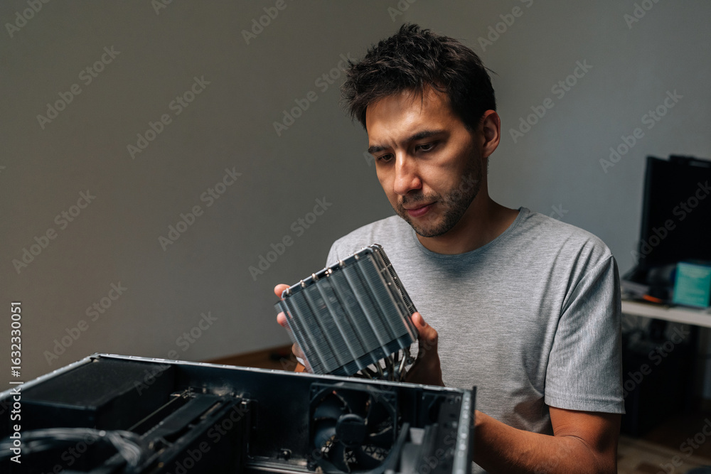 Aufkleber portrait of computer technician installing cooling radiator, carefully positioning computer hardware