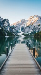 Obraz premium Wooden Pier on a Serene Mountain Lake dock water