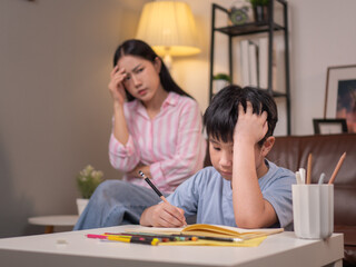 Asian mother upset and worry over teaching son to do homework
