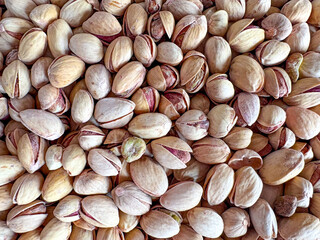 Pistachios photographed from an upper angle. Flat layout with pistachios. Cooking poster.