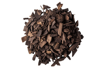 Pile of dark aromatic wood pieces for perfume