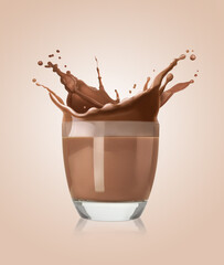 Chocolate milk splashing in glass on beige gradient background