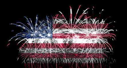 American flag made of fireworks on a black background. USA flag design with pyrotechnic explosions for patriotic holidays as independence day. © Eugene_Photo