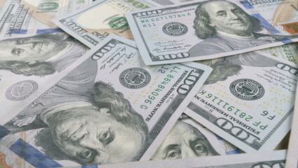 CloseUp of Neatly Stacked U.S. Dollar Bills Displaying Their Intricate Designs and Details