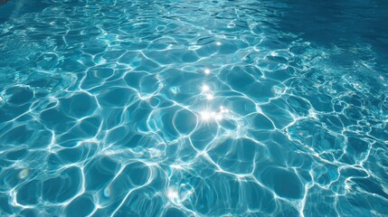Obraz premium Crystal clear turquoise swimming pool water with beautiful sunlight reflections and ripples creating perfect summer vacation and relaxation background