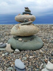 A balanced cairn of zen stones in natural colors representing tranquility and harmony