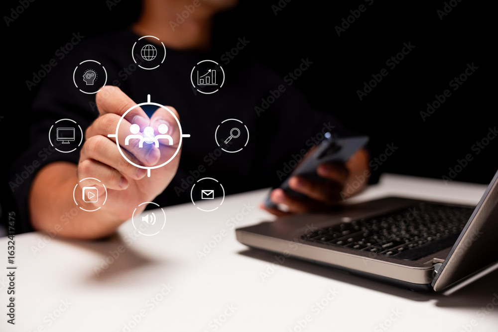 Poster a person interacts with digital icons while using a smartphone and laptop, illustrating technology a