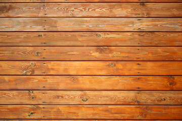 Obraz premium Wooden plank background with natural texture and grain. Rustic surface ideal for design, copy space, or product display. Warm tones and horizontal wood pattern create a cozy, natural look.