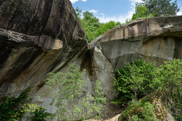 Natural waterfall inside the garden of the blue house, authentic traditional romanian house. Corbi, Romania.