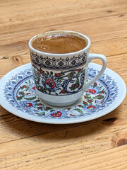 Traditional Turkish Coffee cup on wooden table
