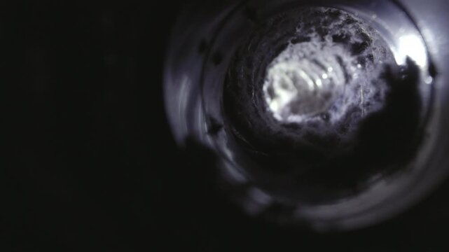 Close-up image of lint buildup inside a dryer vent, highlighting a common household fire hazard. The photo shows accumulated dust, fibers, and debris in the vent pipe, emphasizing the importance of re